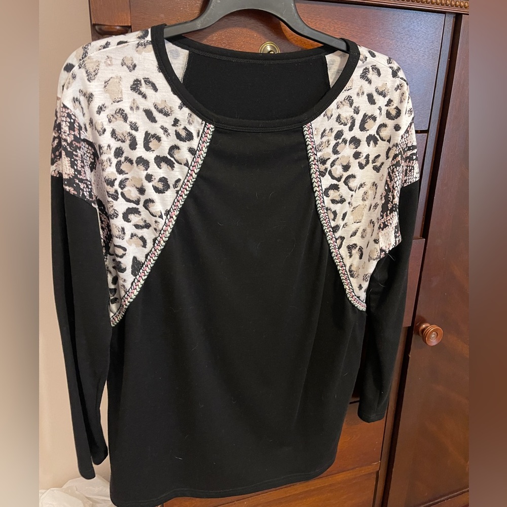 Women’s top.  Black with animal print accents